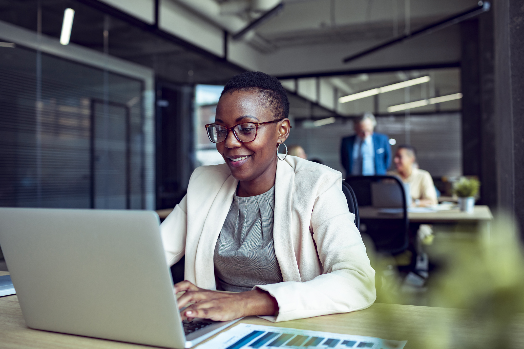 Woman working on laptop in office